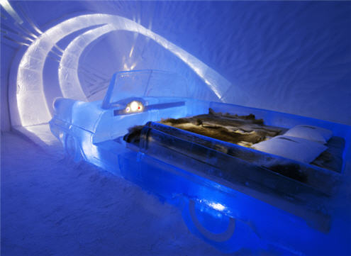 Ice hotel - bedroom with car. This opens a new browser window.