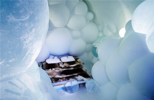 Ice hotel - bedroom with snowballs. This opens a new browser window.