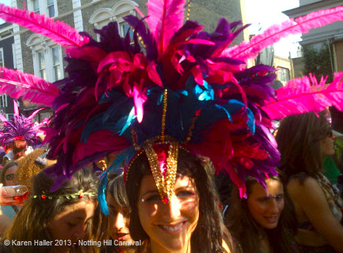 Notting Hill Carnival Karen Haller 2013 - pink and purple feathered head dress.